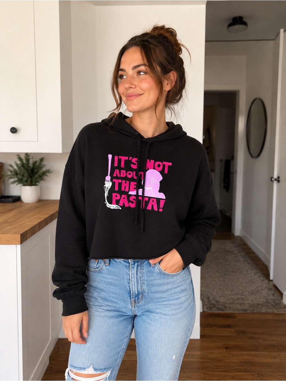 Black Cropped Hoodie with Pink Graphic "It's Not About The Pasta!"